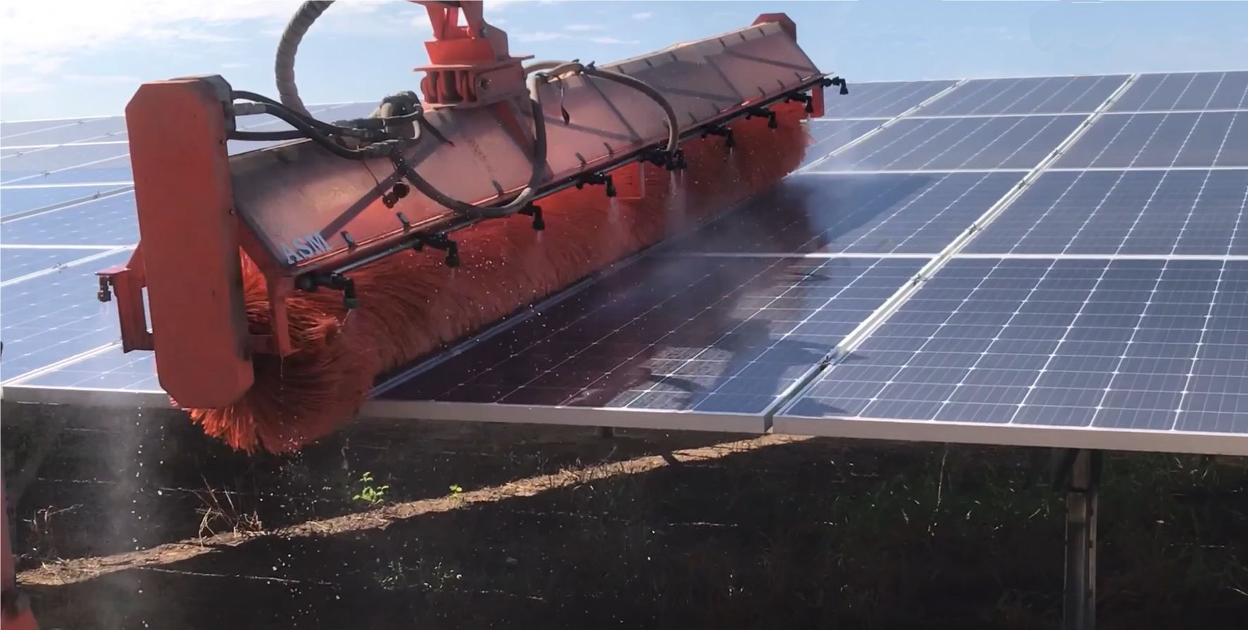 A close-up shot of a solar farm cleaning machine.