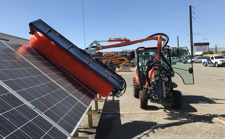 An image of a solar farm cleaning machine.